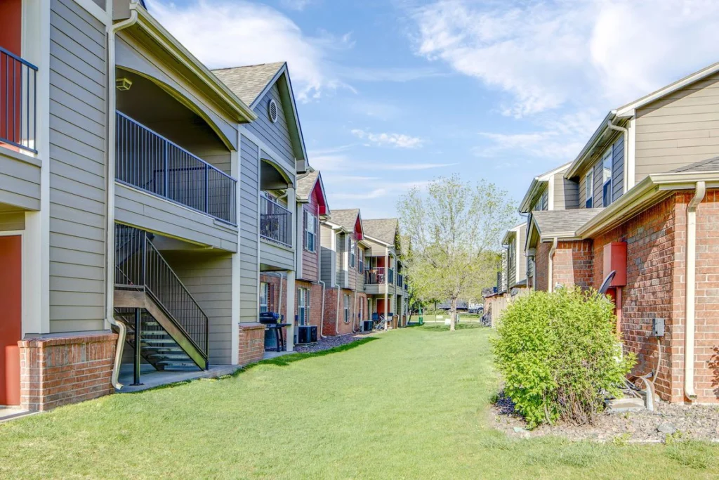 Grassy area between buildings